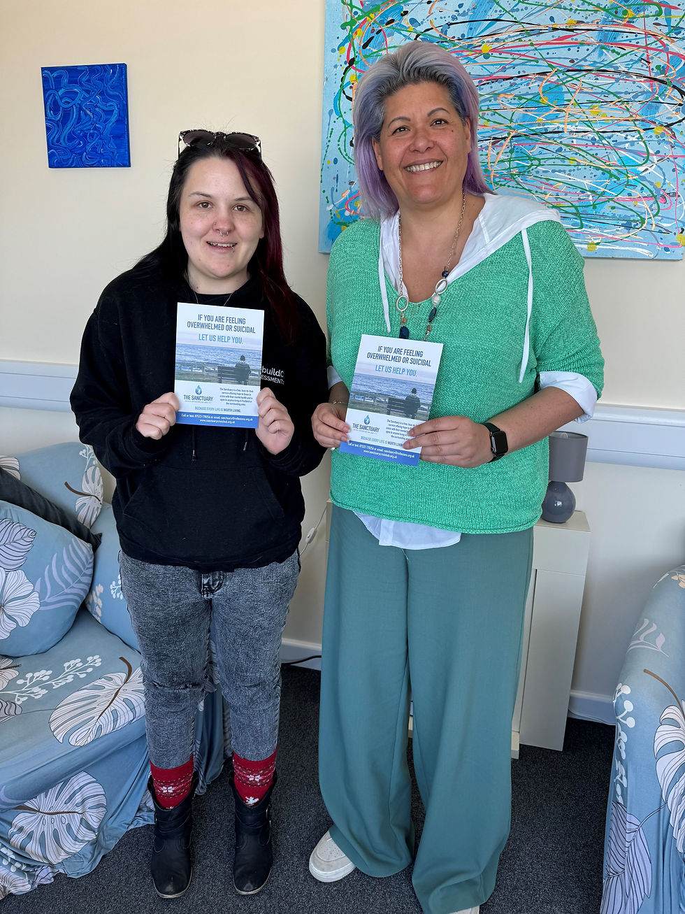 Paige Jolliff and Isabel Sommers with flyers for 'The Sanctuary Crisis Intervention Hub' in Portland