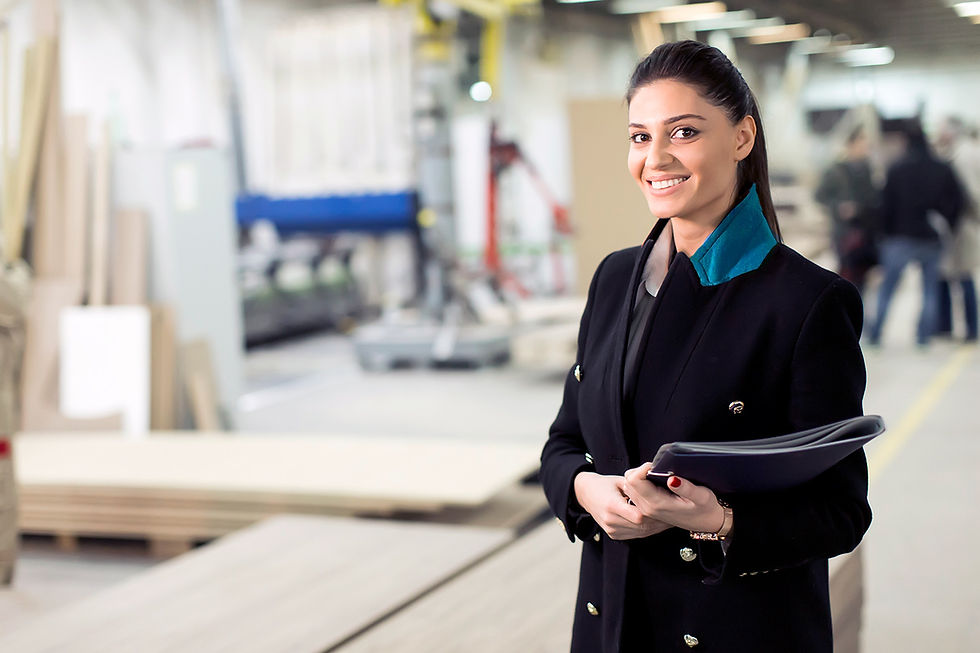 Female risk management surveyor assessing commercial insurance risk